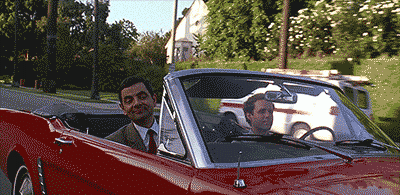 Гифка мистер Бин показывает всем факи из машины