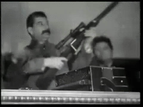 Сталин gif с ружьём, расстрелять мем.
