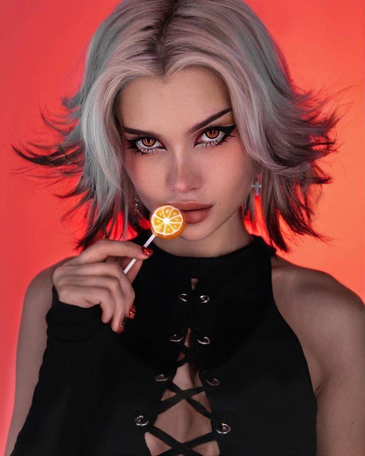 Красивое фото с ярким макияжем и оранжевым чупа чупсом. Красивое фото с ярким макияжем и оранжевым чупа чупсом.