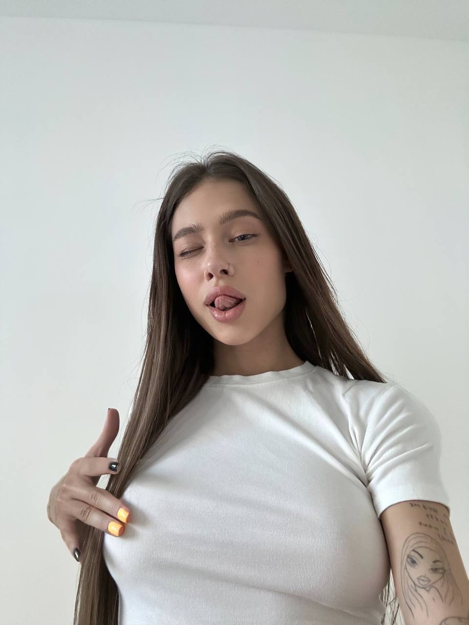 А тут девушка трогает себя за грудь и показывает язык.