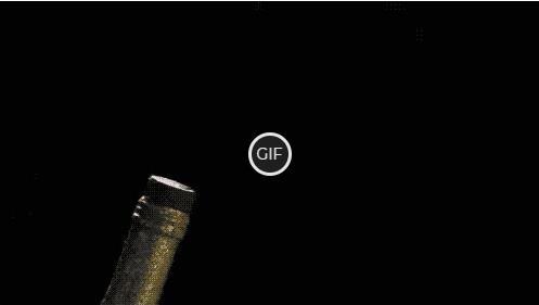 Гифка пробка вылетает из бутылки с шампанским